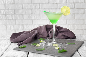 Fresh summer cocktail in glass on slate plate