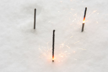 Burning glittering sticks