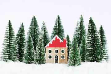 Landscape forest with christmas trees and house on the snow in winter. Christmas holiday celebration and new year concept
