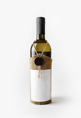 Vintage wine bottle with blank label and wax seal.