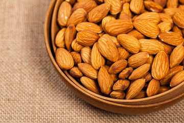 Almonds Nuts in the Bowl Background. Selective focus.