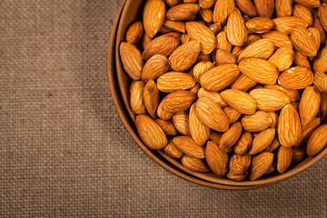 Almonds Nuts in the Bowl Background. Selective focus.