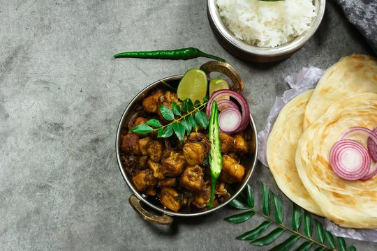 Kerala Spicy Beef Roast or Fry with Porotta and rice, top view