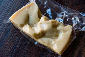 Turkish Traditional Gravyer / Gruyere Cheese in Package From Kars on Wooden Surface.
