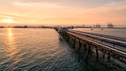 Obraz premium oil tanker, gas tanker in the high sea.Refinery Industry cargo ship,aerial view,Thailand, in import export, LPG,oil refinery, Logistics and transportation with working crane bridge in harbor