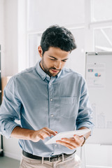 handsome architect using tablet in office