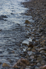 Detailed stone beach and clear blue sea in Croatia. Many stones under the sea level.
