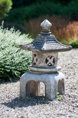 Small statuette resembling tower made of stone