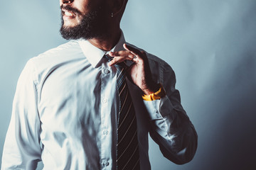 Corporate beard man releases tight tie 