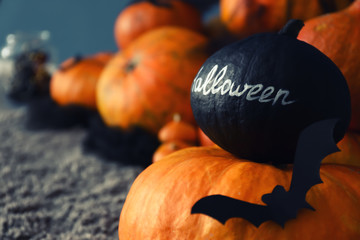Pumpkins prepared for Halloween party on floor
