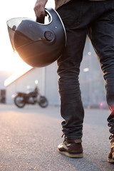 Fototapeta premium biker guy in front of classic style motorcycle