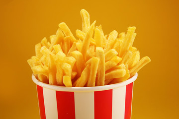 Potatoes French Fries in Red and white Carton Package Box. Fast Food.