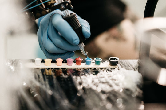 Crop Hand Taking Ink For Tattoo