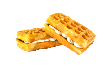 Soft waffles with a filling. Two waffles with a cream filling on a white background.