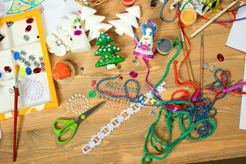 Fototapeta premium Handmade decorations for new year and other holidays. Artwork workplace with creative accessories.