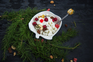 light breakfast of rustic cottage cheese red cherries decorative white plates teaspoon