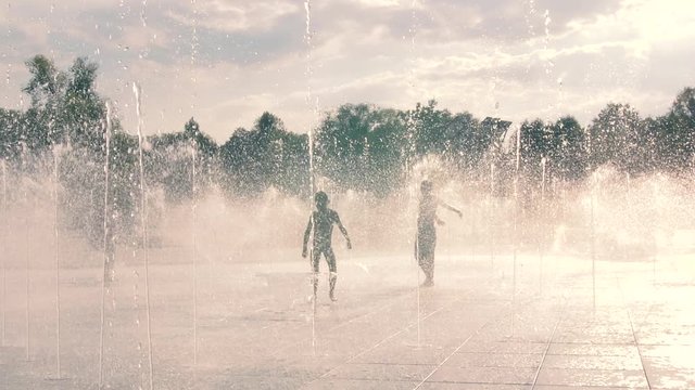 Kids playing in the fountain. Park Szymanskiego in Warsaw, Poland, new part 09.2018