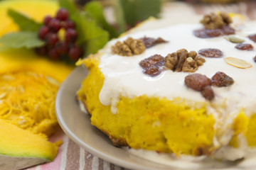 Pumpkin homemade cheesecake with white cream. Autumn still life. Thanksgiving day food.