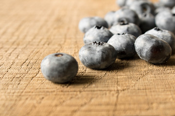 Fresh blueberries on an old wooden table. Close up. The concept of natural food