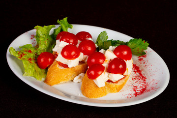 Bruschetta with cheese and tomato