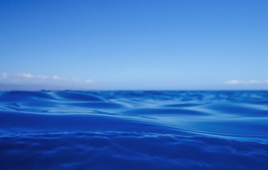 Fototapeta na wymiar Close Up Blue Ocean Surface with Sky