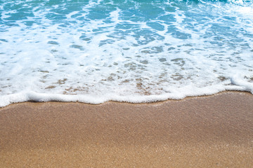 Fototapeta na wymiar The sea wave rolled on the sand