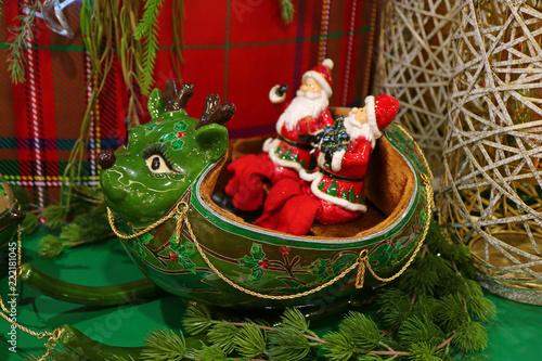 Two Santa Claus Riding Green Reindeer Shaped Sleigh A Unique Christmas Home Decoration Two Santa Claus Riding Green Reindeer Shaped Sleigh A Unique Christmas Home Decoration