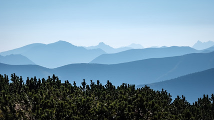 mountain top panorama in  autumn covered in mist or clouds