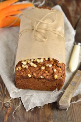 Pumpkin bread loaf with oatmeal and walnuts, vertical