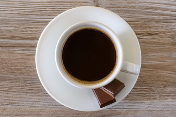 cup of coffee on wooden background