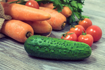 Concept of healthy nutrition and vegetarianism. Close up photo of different tasty fresh juicy vegetables on wooden table