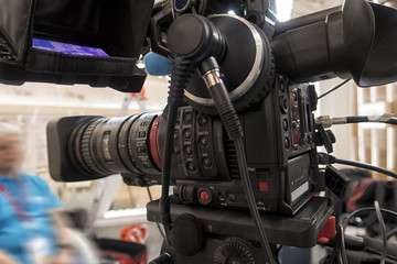 Professional tv camera in live show pavilion.