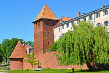Fototapeta na wymiar Fortification, watchtower and gymnasium of Jesuits in the summer afternoon. Braniewo, Poland