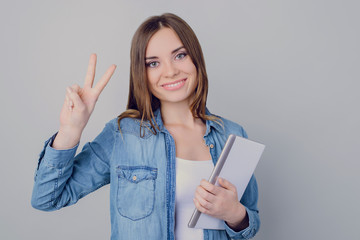 Hi hello! Portrait of pretty lovely peaceful calm confident smart clever charming delightful rejoicing entrepreneur making v-sign wearing casual outfit isolated on gray background copy-space