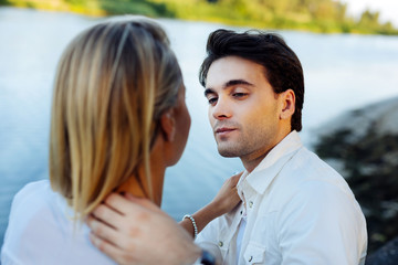 Being together. Nice young couple looking at each other while enjoying their romantic date