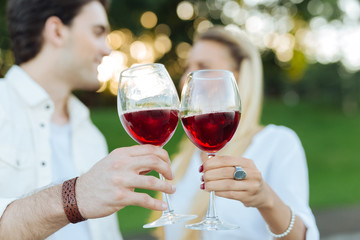 Romantic celebration. Selective focus of glasses with red wine during a romantic celebration