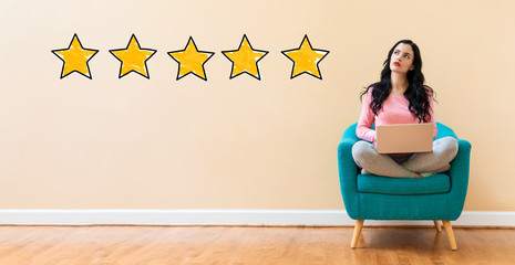 Five Star Rating with young woman using a laptop computer 