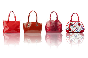 Red female handbags collection isolated on white background.Front view.


