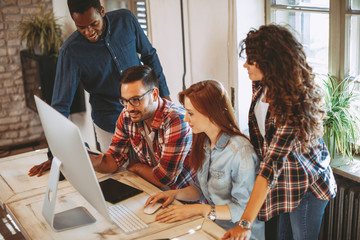 Young group of designers negotiates about design