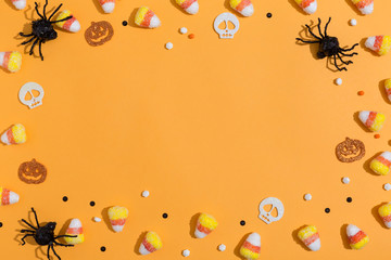 Halloween spiders overhead view on a solid color