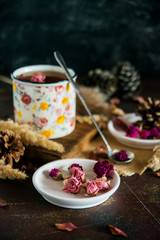 Flower tea: tea rose, petals, edible flowers, on a light background
