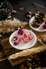 Fototapeta na wymiar Flower tea: tea rose, petals, edible flowers, on a light background