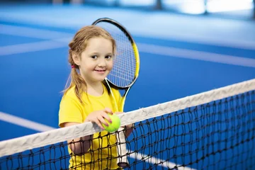 Poster Child playing tennis on indoor court © famveldman