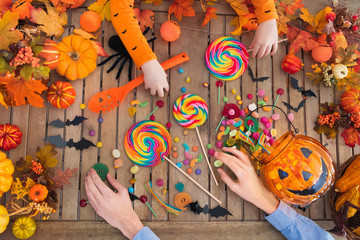 Halloween trick or treat candy and pumpkin.