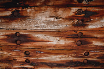 Background is old dark wooden from ship and rusty nails.