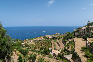 Fototapeta na wymiar historic village of Banyalbufar on Mallorca, Spain against blue sky and sea on sunny summer day