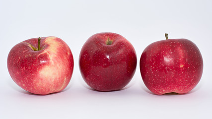 Fresh red apples on a white background