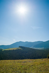 View on the mountains and hills Scenic view with green valleys over natural sunny sky