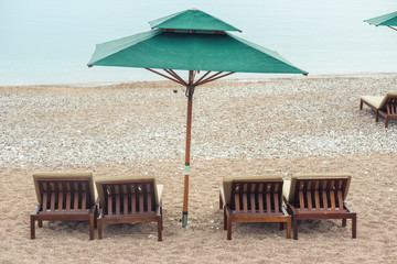 A beautiful Mediterranean beach with umbrellas and sun loungers