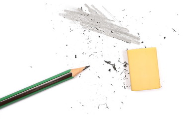 Graphite pencil and eraser with shavings isolated on white background, top view